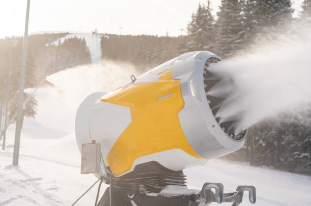 istock Snow cannon in winter mountains. Snow-gun spraying artificial ice crystals. Machine making snow. 1409893150