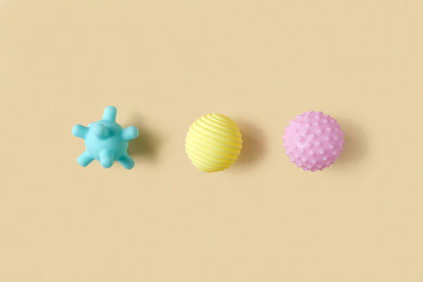 istock Tactile or sensory balls to enhance the cognitive processes. Top view. Flat lay. Copy Space. Textured ball set, colorful soft squeezy sensory toys to enhance physical processes. 1409893262