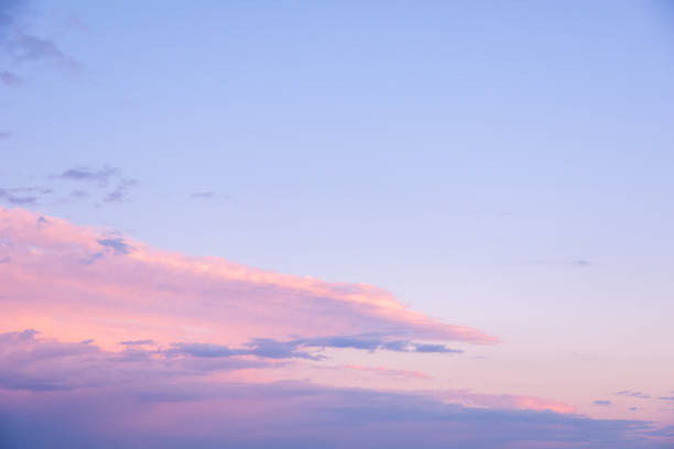 istock Abstract pink sunset sky background with motion blur. Bright pink-blue sky background. Natural sky background 1409895595