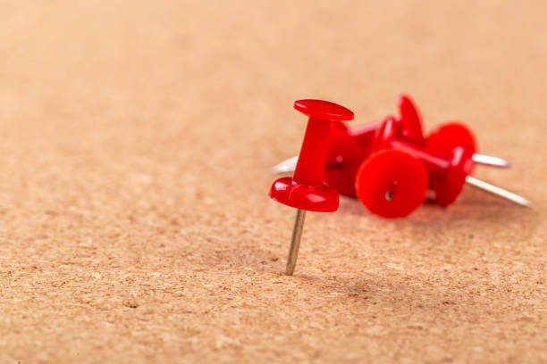 istock Pin board texture for background and colorful pins 1409898012
