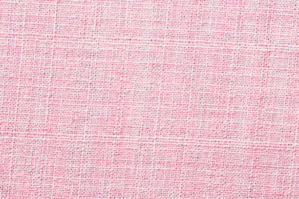 istock light red linen fabric as background, natural fabric texture 1409899456