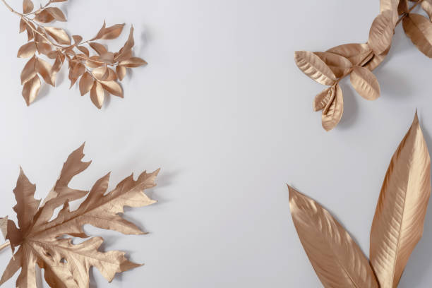 istock Gold tropical palm leaves Monstera on white background. Flat lay 1409901585