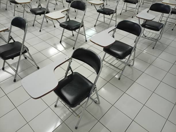istock Foldable and portable chair with a modern design for training or workshops equipped with writing desk handles 1409902188
