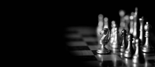 istock Pieces on chess board for playing game and strategy panorama 1409903243