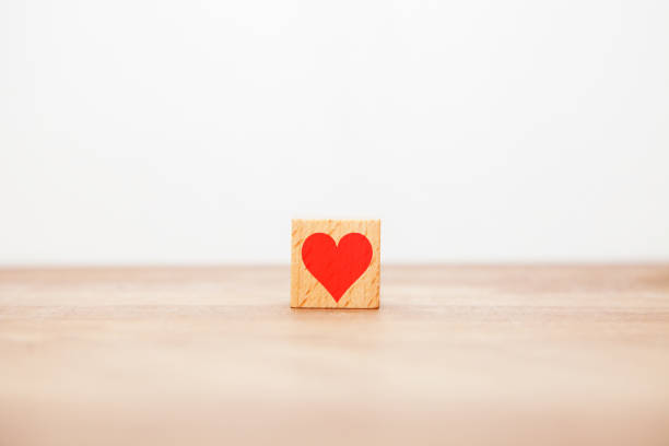 istock Red heart symbol. Like. Affection expression. Written on a wooden block. 1409903616