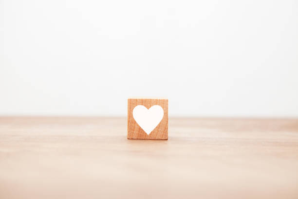 istock White heart symbol. Like. Affection expression. Written on a wooden block. 1409903731