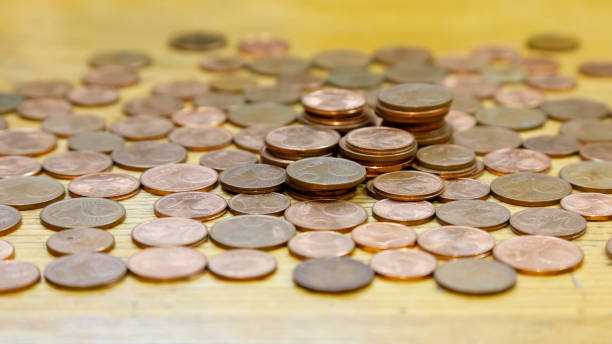 istock Euro currency, coins lie on the table 1409905101