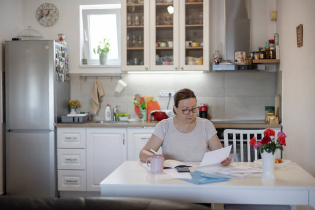 istock Woman banking from her home office 1409905209