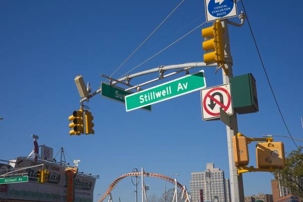 Stillwell Av street sign on Coney Island Brooklyn, NY, USA - July 20, 2022: Stillwell Av street sign near Surf Ave, one of the major intersections on Coney Island warren street brooklyn stock pictures, royalty-free photos & images