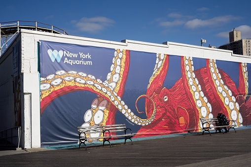 Brooklyn, NY, USA - July 20, 2022: The New York Aquarium welcome banner on the boardwalk at Coney Island