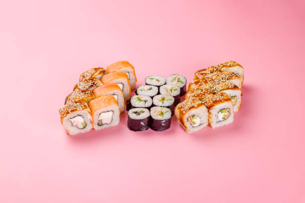 istock set of different rolls and sushi on pink background 1409909970