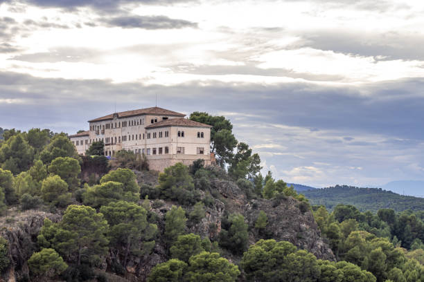 istock Ancient monastery in the mountains surrounded by green trees, in murcia, spain 1409911546
