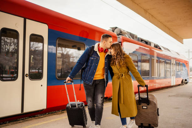 istock Young couple arriving on the train station 1409913872