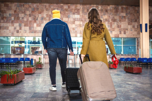 istock Young couple arriving on the train station 1409914561