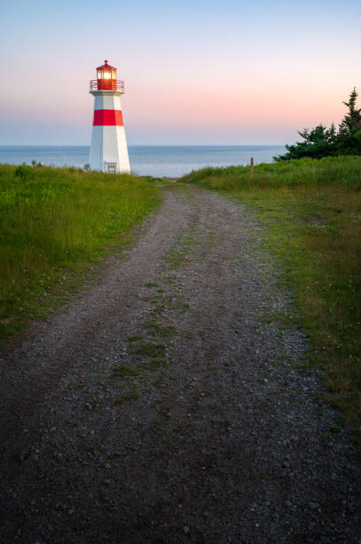 istock Musquash head lighthouse at dusk 1409914812