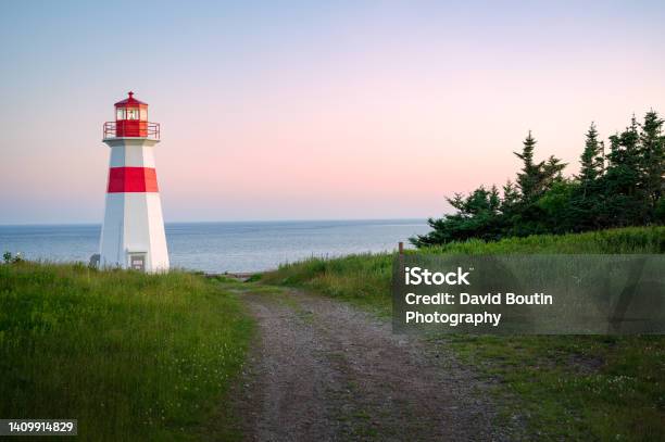 Musquash Head Lighthouse At Dusk Stock Photo - Download Image Now - Lighthouse, Canada, New Brunswick - Canada