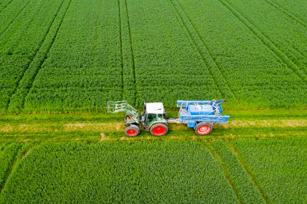 istock Tractor with Crop Sprayer, Aerial View 1409916274