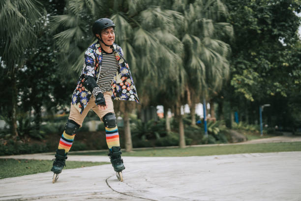istock Asian Chinese gay person practicing inline skating in public park 1409917284