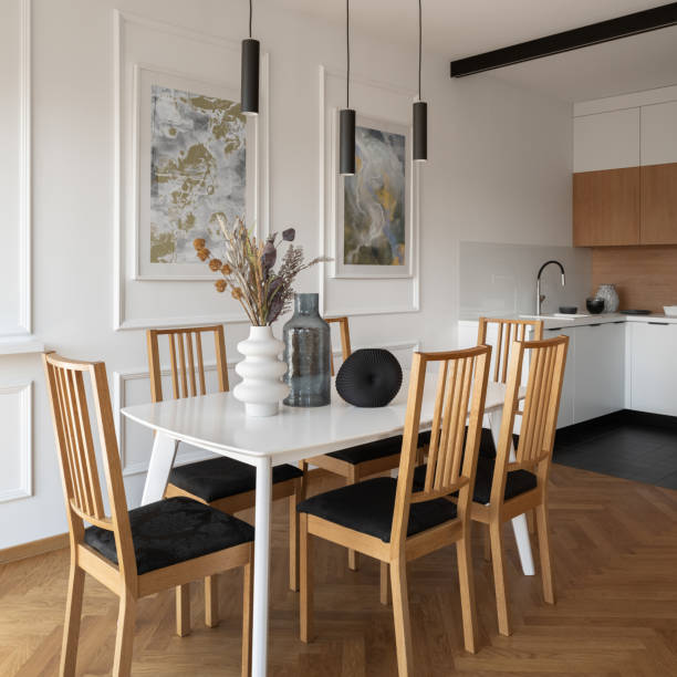 istock White dining table with wooden chairs 1409917759