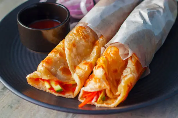 delicious Indian street food "egg rolls" is ready to eat.