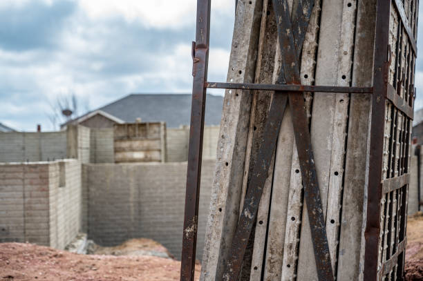 istock Stacked removable concrete forms for a basement at a residential home construction site 1409921344