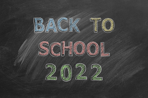 Hand drawn Back to School 2022 text on blackboard.