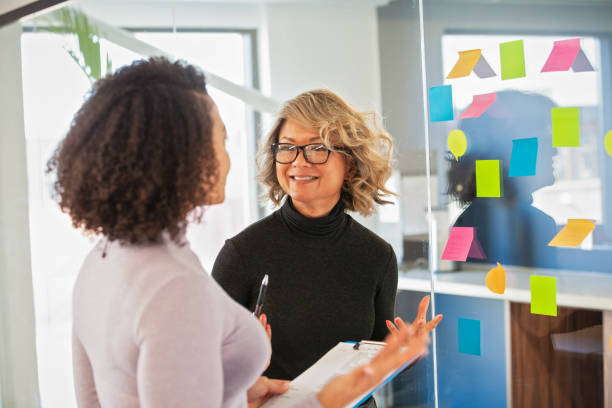 istock Female Coworkers Sharing Ideas 1409923333