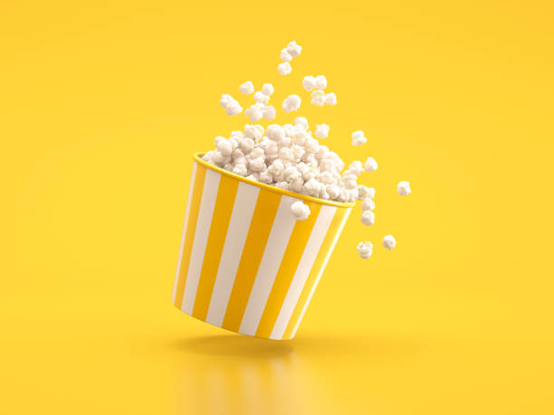Popcorn in yellow white striped bucket stock photo