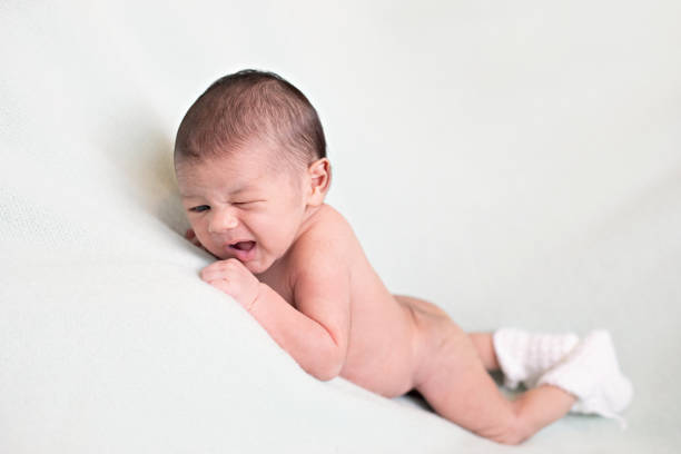 Photos of a newborn baby boy at less than a week old