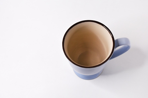 High angle view empty coffee cup on the white background with copy space