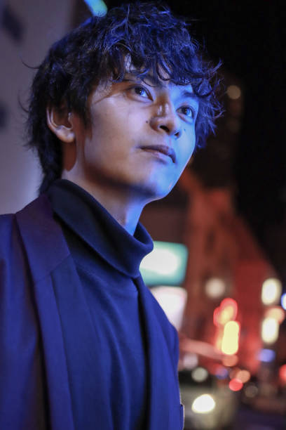 istock Portrait Of Young Asian Man At Night 1409926257
