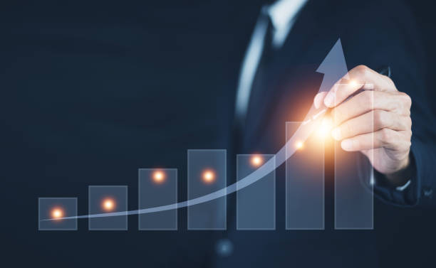 istock Business growth concept, Business development to success and growing growth concept, Businessman pointing arrow graph corporate future growth plan 1409928740