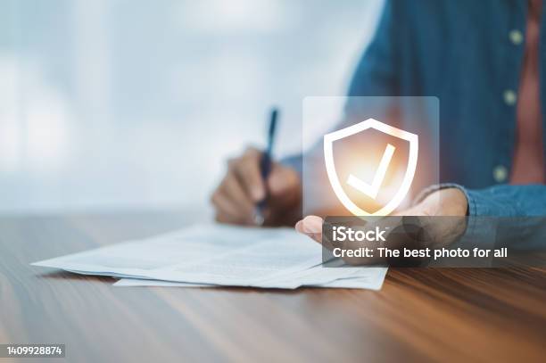 Man Signature Document For Life Insurance Investment Stock Photo - Download Image Now