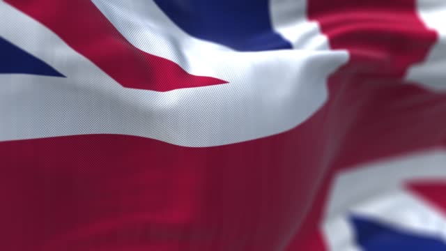 Close-up view of the United Kingdom flag waving in the wind