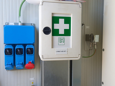 Electric Power socket with first aid box on the wall.