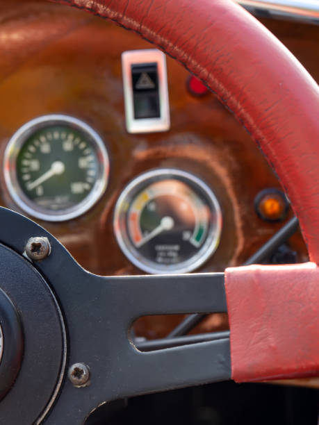istock selective focus of steering wheel and dashboard of classic car 1409935075