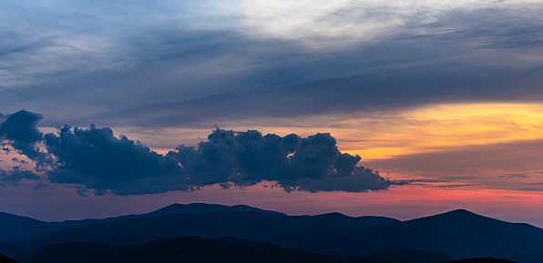 Nature is the best artist. When the mountains are calling, it is the time to immerse ourselves into the grandeur. Sunset with dramatic skies at Blue Ridge Mountains range in North Carolina, USA