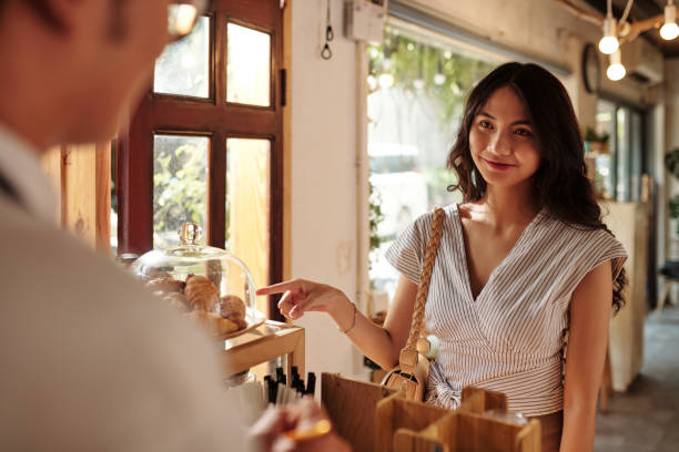 istock Woman Buying Fresh Croissants 1409940050