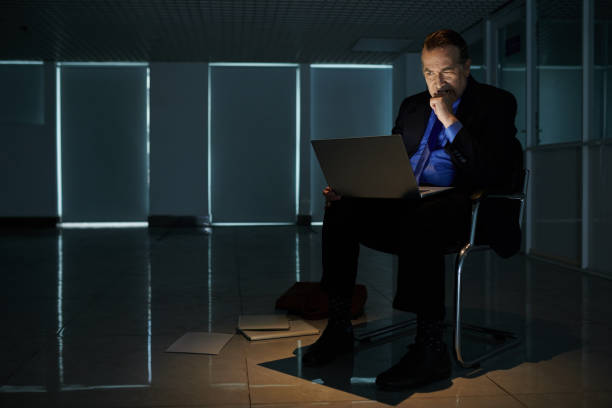 istock Nervous Entrepreneur Reading Article on Cryptocurrency Trends 1409941599