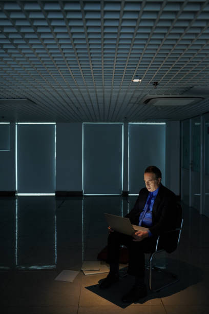 istock Middle-aged Businessman Working on Laptop 1409941609