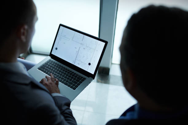 istock Engineer and Investor Discussing Blueprint 1409941611