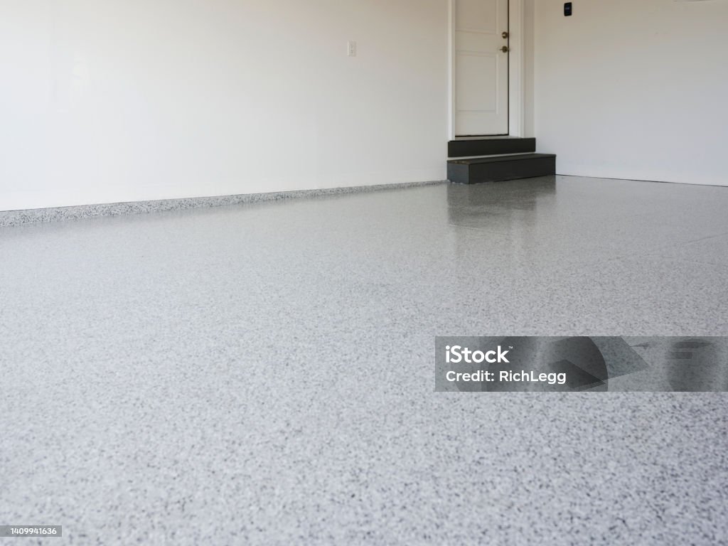 Epoxy Garage Floor A freshly coated epoxy garage floor. Flooring Stock Photo