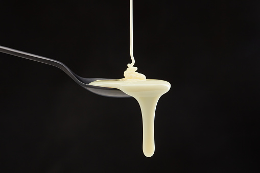 Close-up of splashing droplet of milk.
