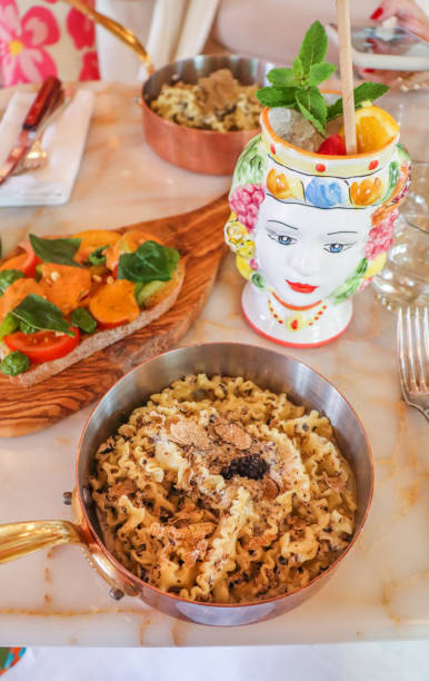 Italian restaurant truffle Pasta and bruschetta with fresh tomatoes in positano amalfi tavern Italian restaurant truffle Pasta and bruschetta with fresh tomatoes in positano amalfi amalfi food stock pictures, royalty-free photos & images