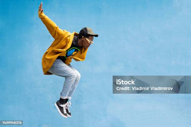 Man Doing Contemporary Modern Dance Move Stock Photo - Download Image Now - Jumping, Fashion, People