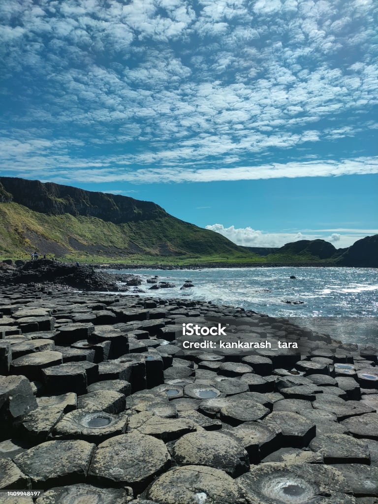 photograph of The Giant's Causeway in Northern Ireland on a sunny day in mid-spring Giants Causeway Stock Photo
