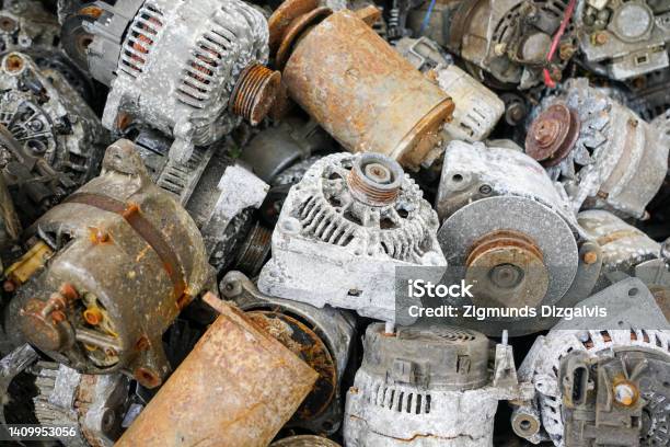 A Pile Of Used Car Starters And Generators Scrap Electric Motors Stock Photo - Download Image Now