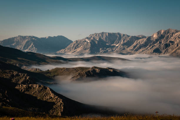 istock Sunrise mountain ranges clouded lows, clear air 1409954184