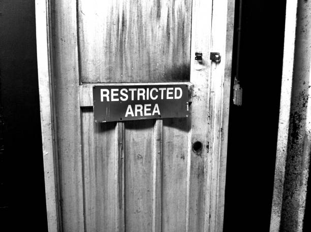 istock Noir – Damaged Door with Restricted Access Sign 1409954301