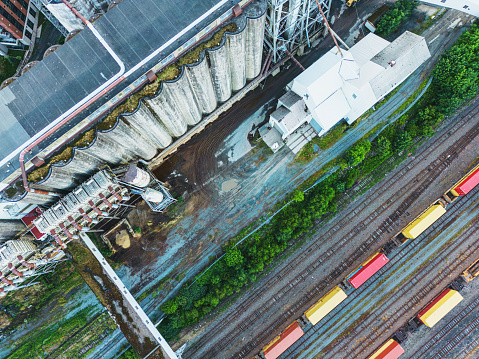 Aerial drone view of a grain elevator & railyard.